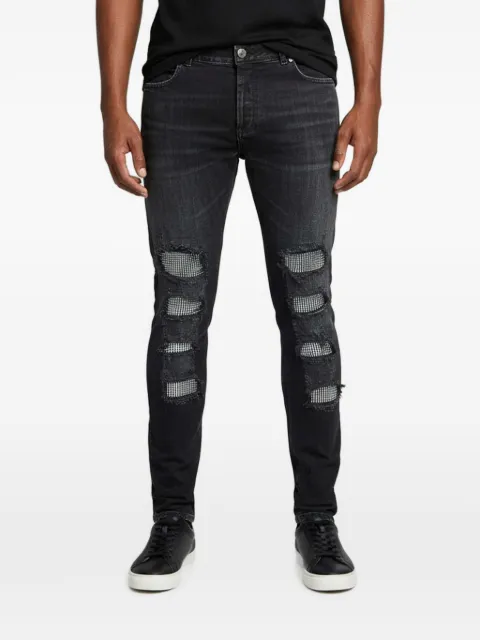 Balmain Pre-Owned crystal-embellished distressed jeans Black 1353336